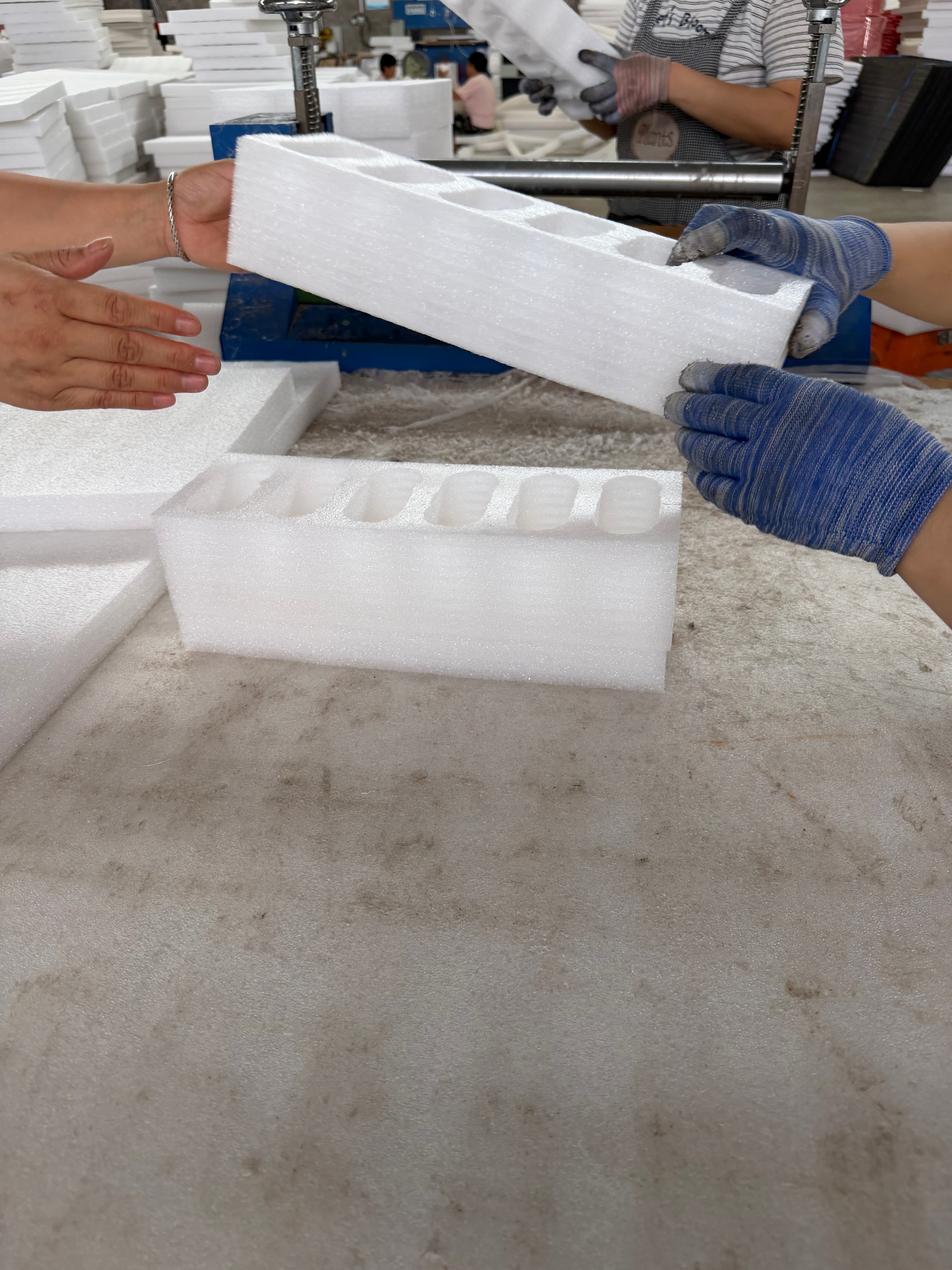 ZH PACK workers inspecting custom EPE foam packaging