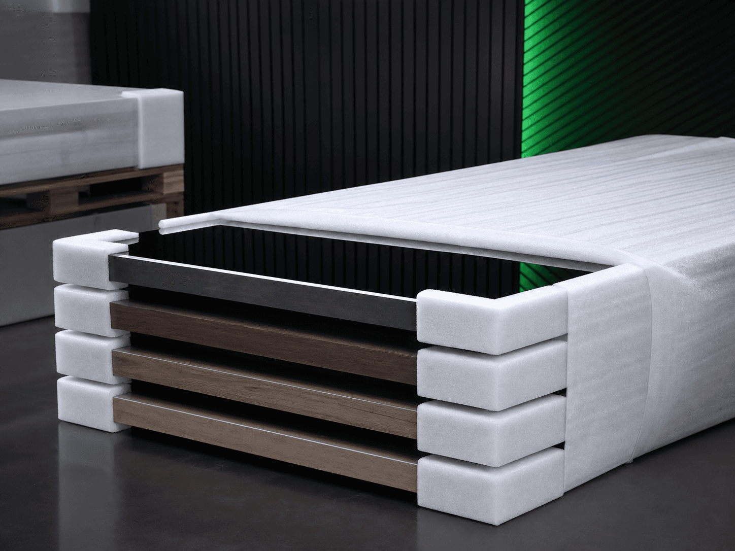 Furniture panels protected by EPE foam edge guards and wrapping